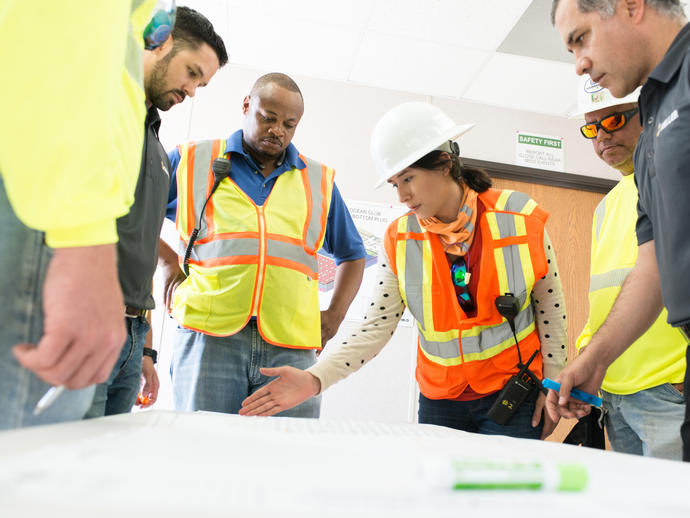 Employees discussing Ritz Carlson project